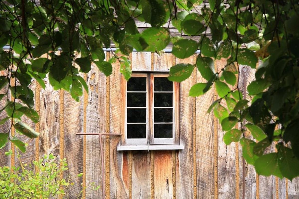 a window on the side of a wooden building