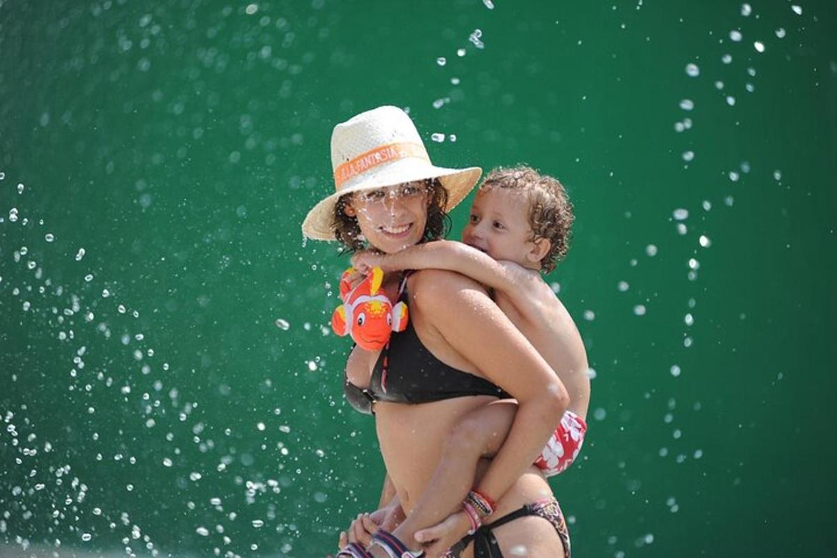 a woman in a hat holding a baby