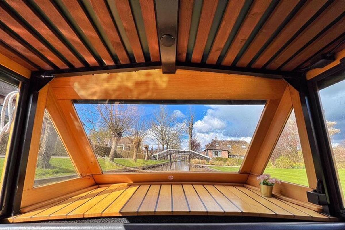 a large window in a room with a view of a bridge