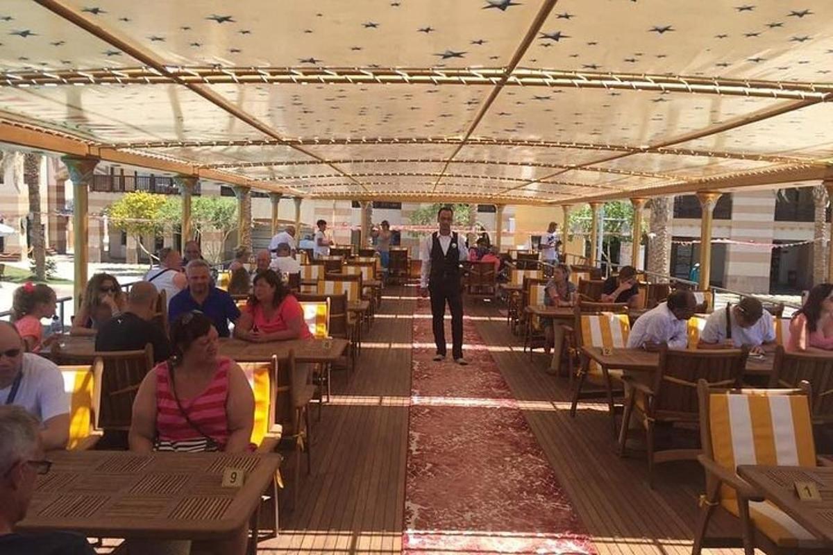 a man in a suit is standing in a restaurant