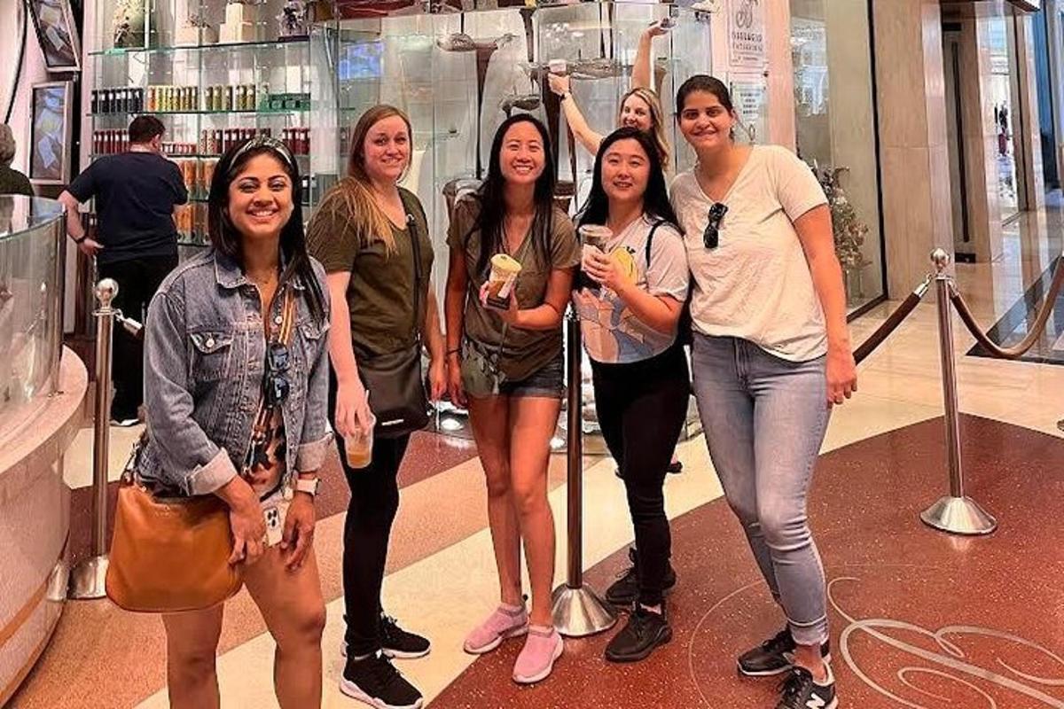 a group of women posing for a picture in a store