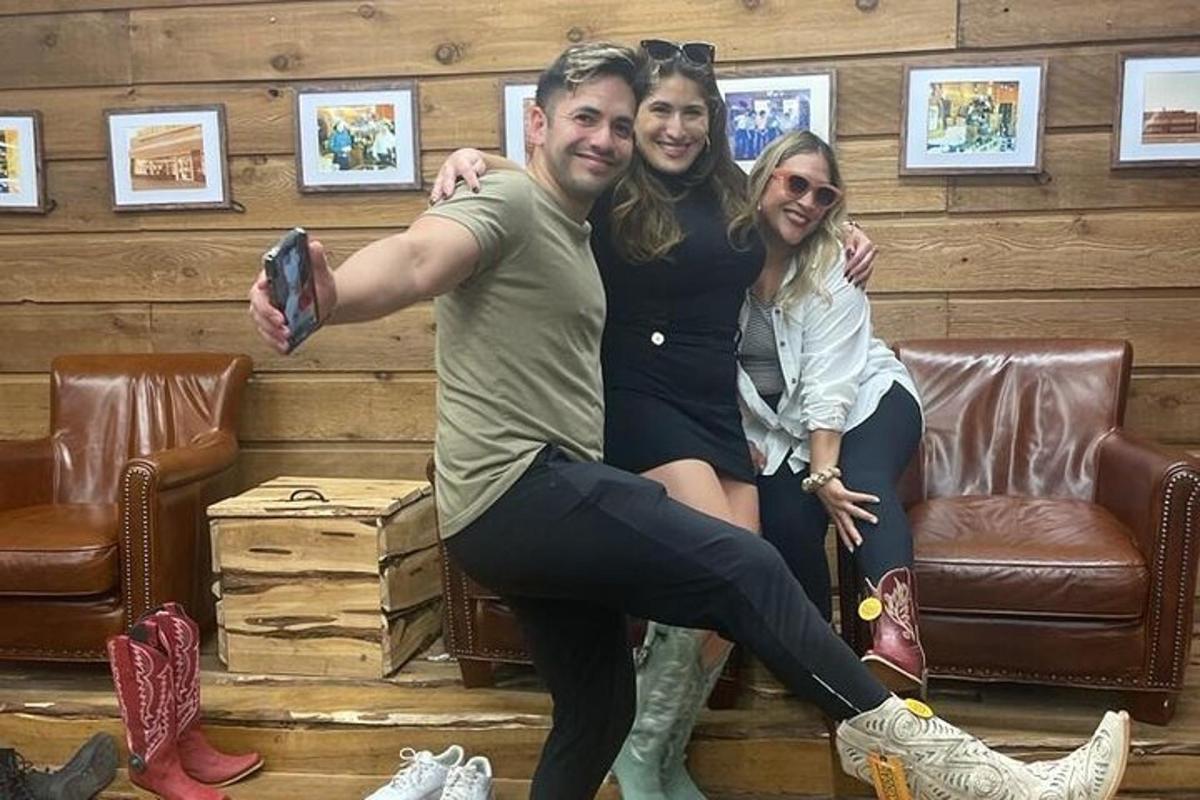 a man and woman posing for a picture in a room