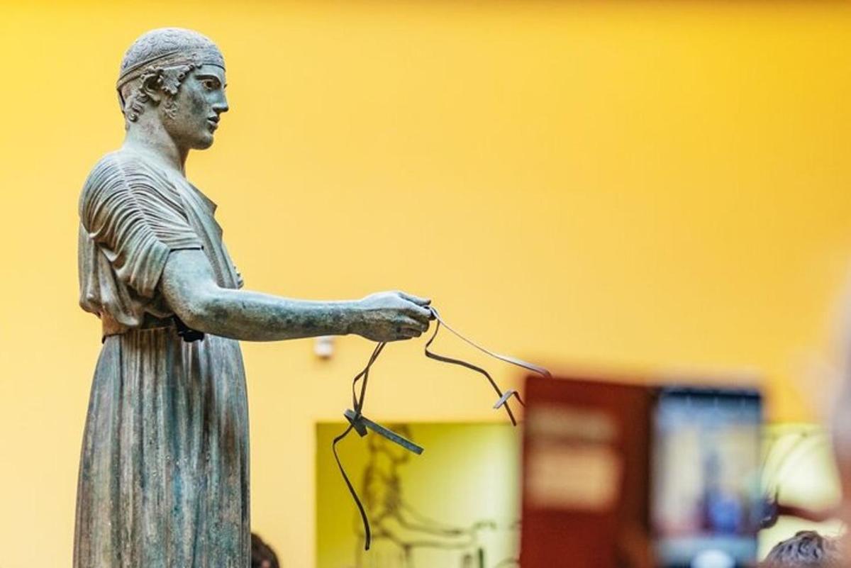 a statue of a woman holding a string