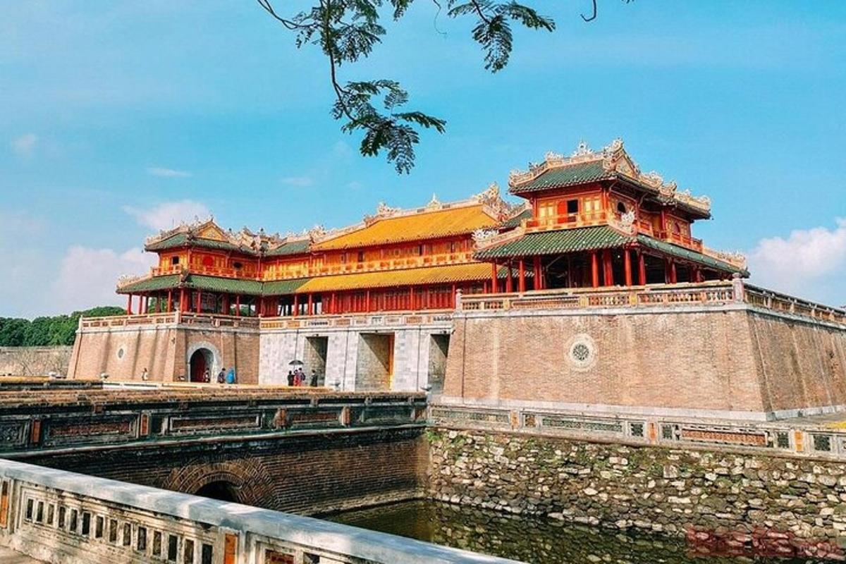 a large building with a bridge in front of it