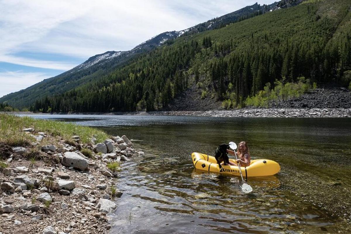 a couple of people in a raft in a river
