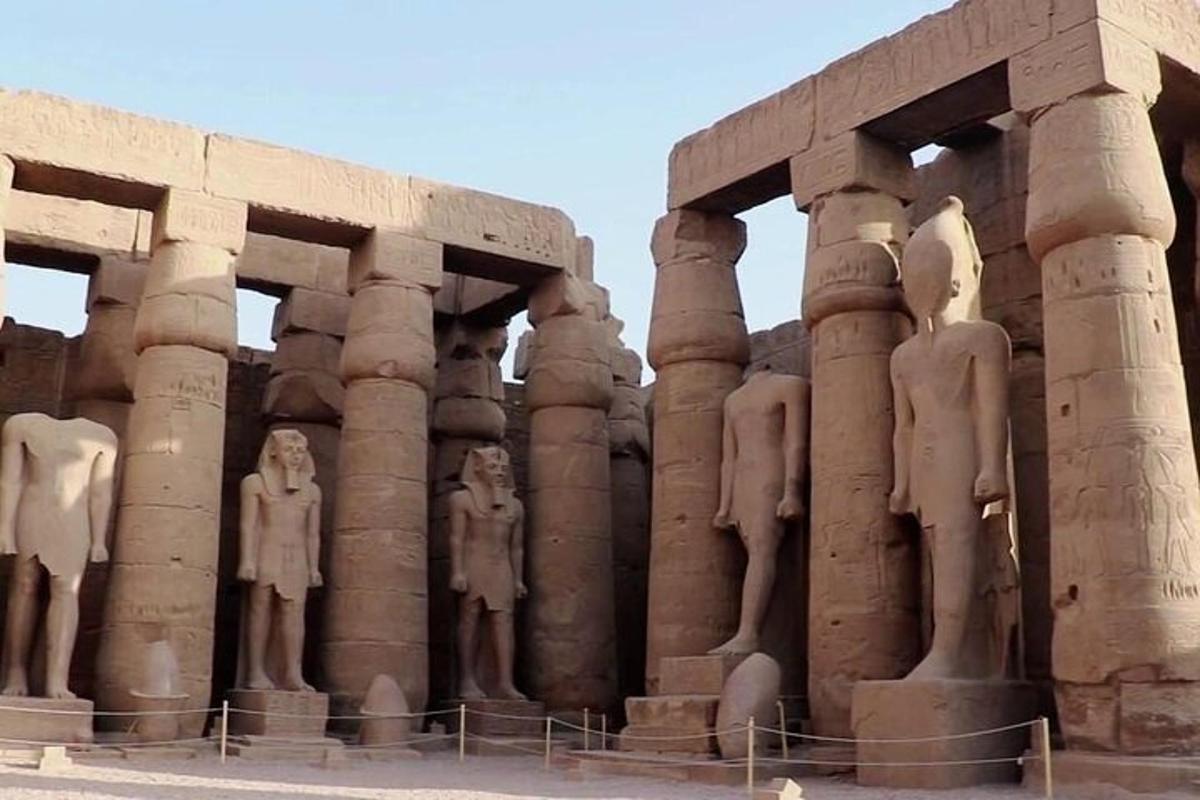 a group of statues on the side of a building