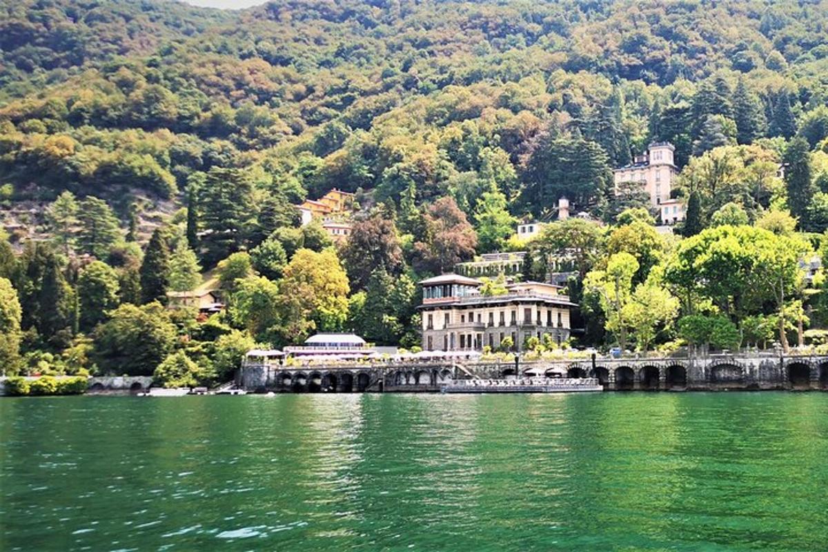 a large building sitting on the side of a lake
