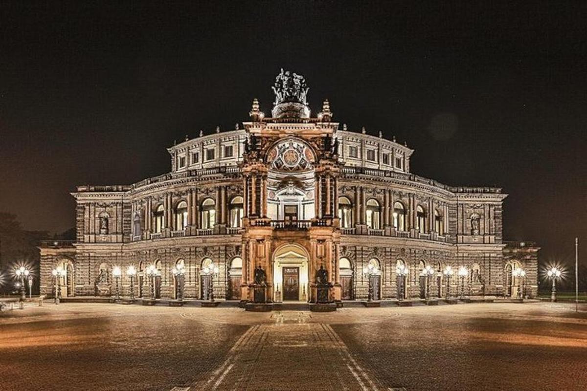 a large building with a clock on it at night