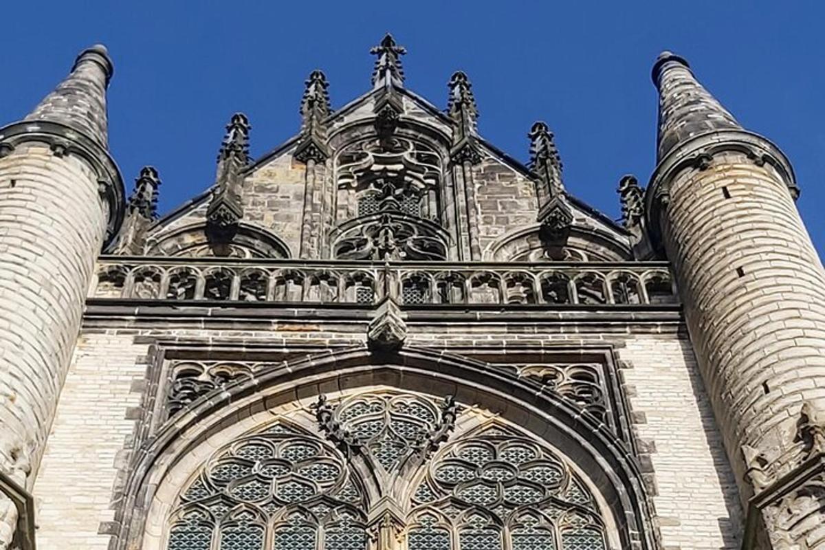a large building with an arch in front of it