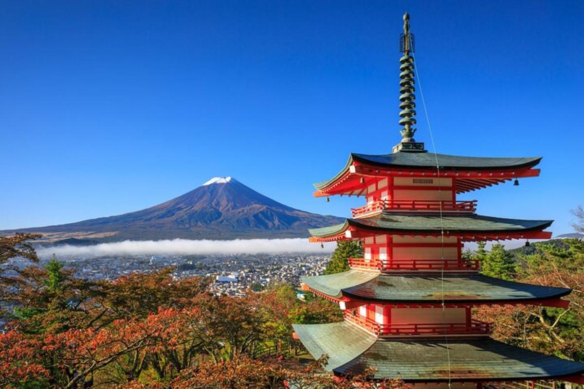 a pagoda with a mountain in the background