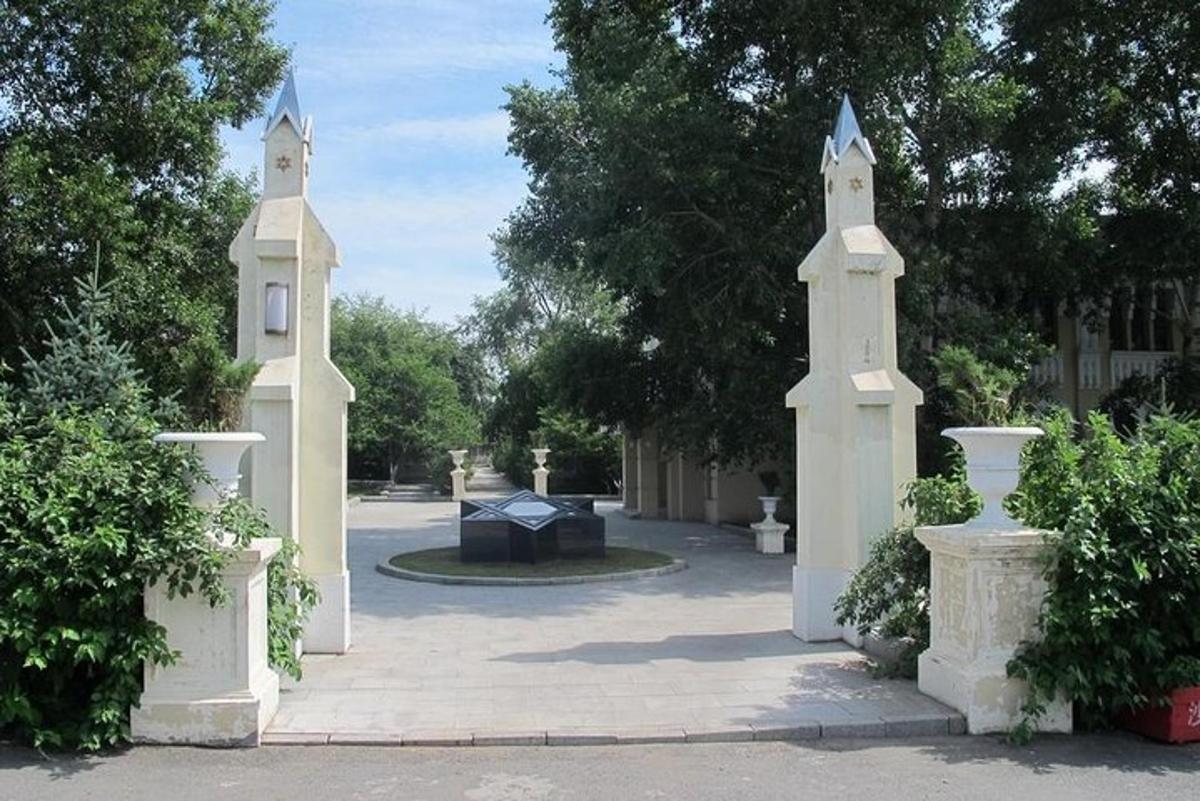 a pair of white gates in a courtyard
