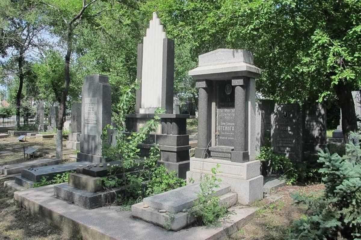 a monument in a cemetery in a park