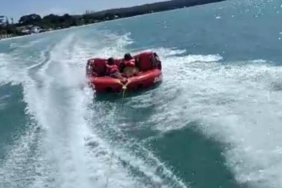a group of people on a raft in the water