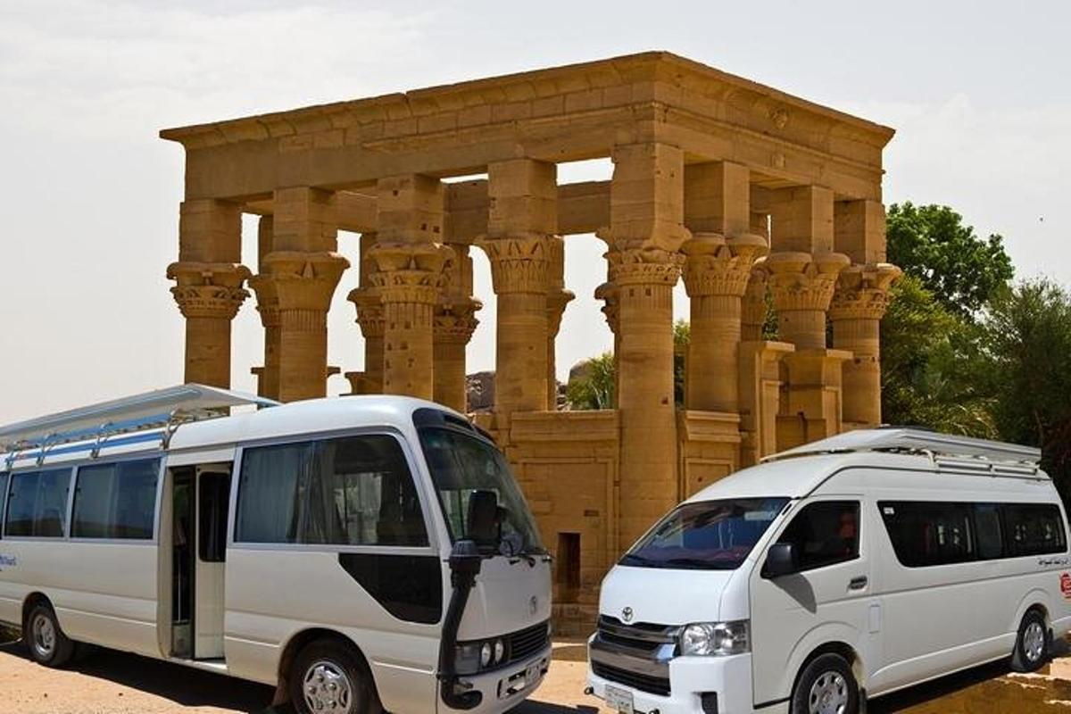 two white vans parked in front of a building