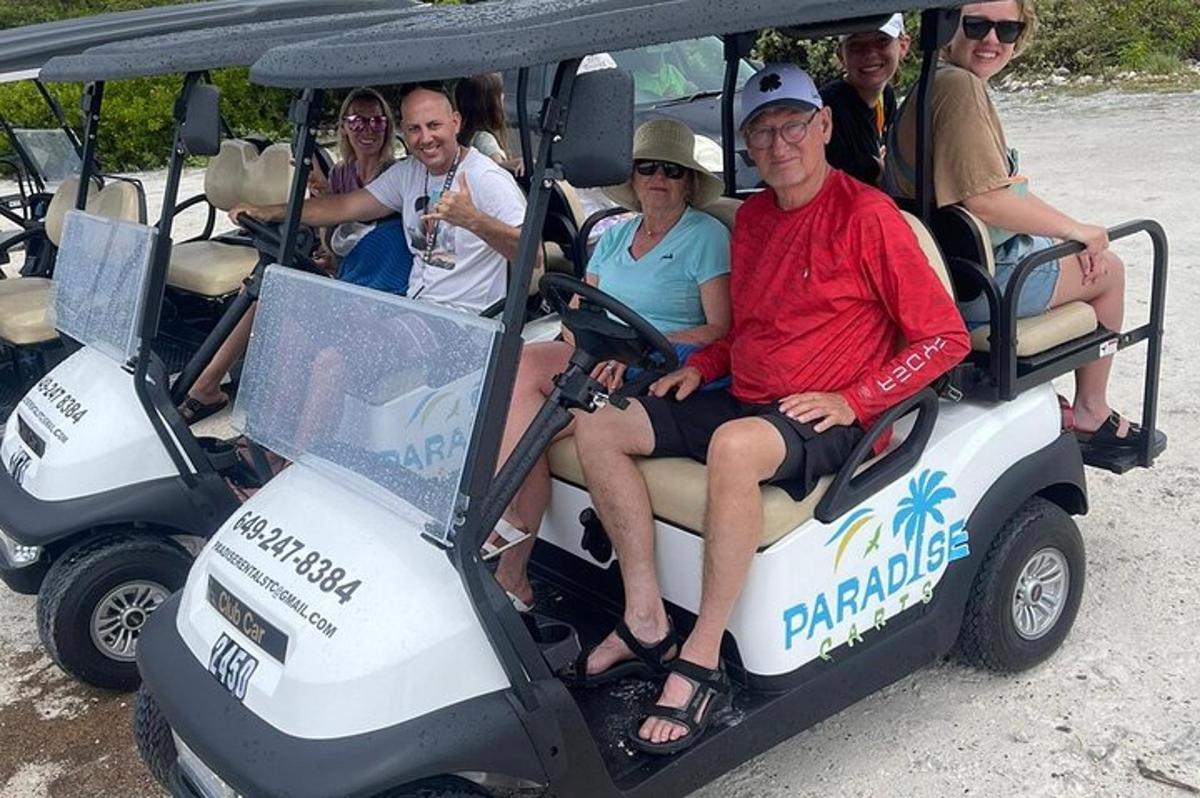 a group of people riding in a golf cart