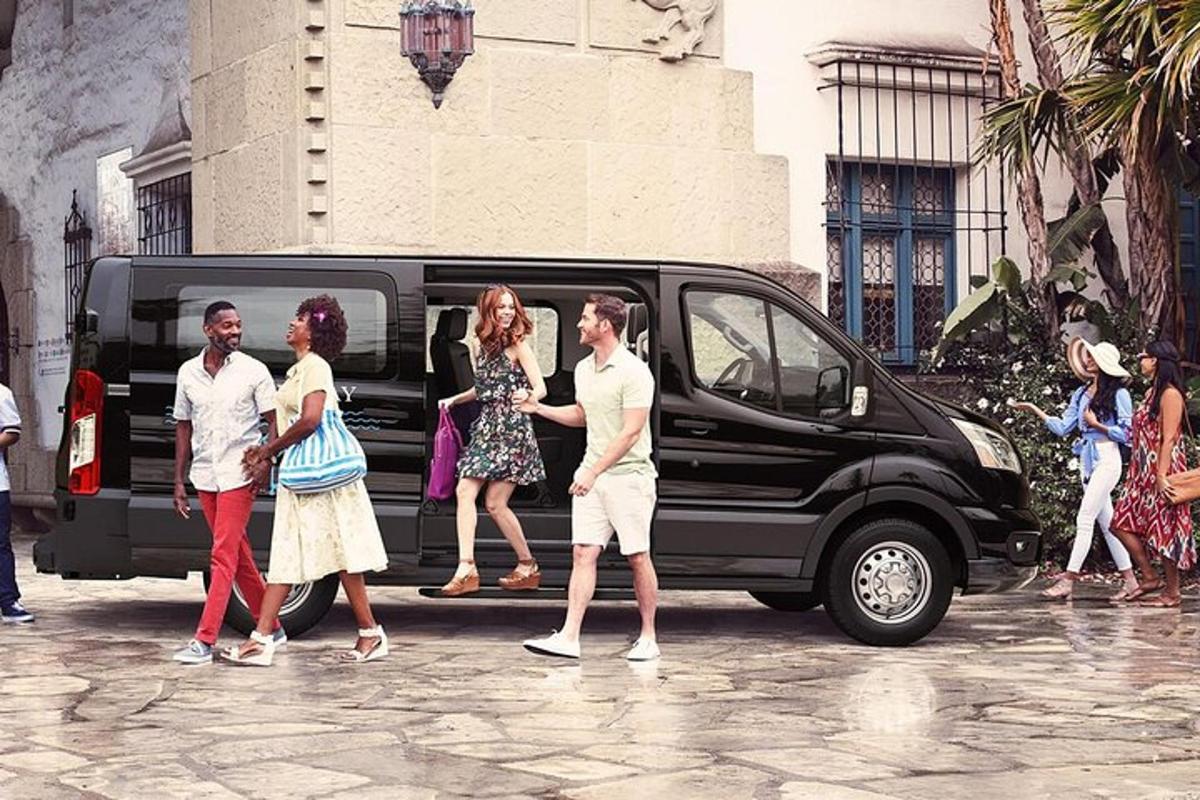 a group of people walking next to a van