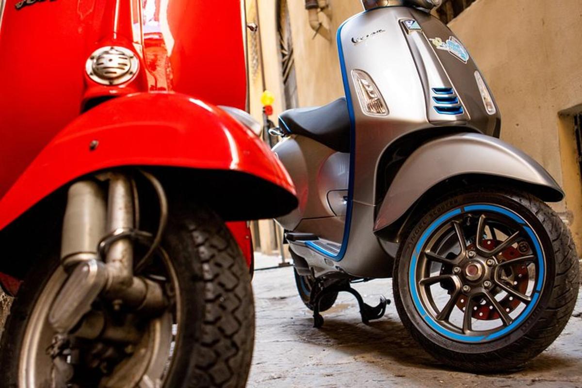 a red and silver motor scooter parked on a street
