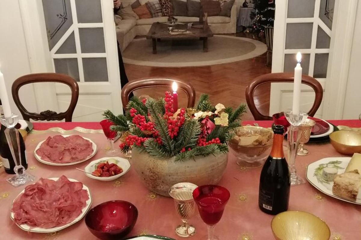 a table topped with plates of food and a bottle of wine