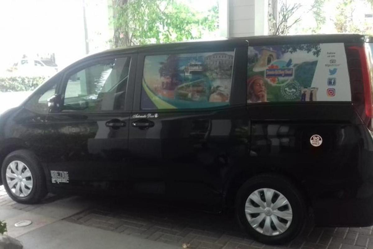 a black van is parked in a parking lot