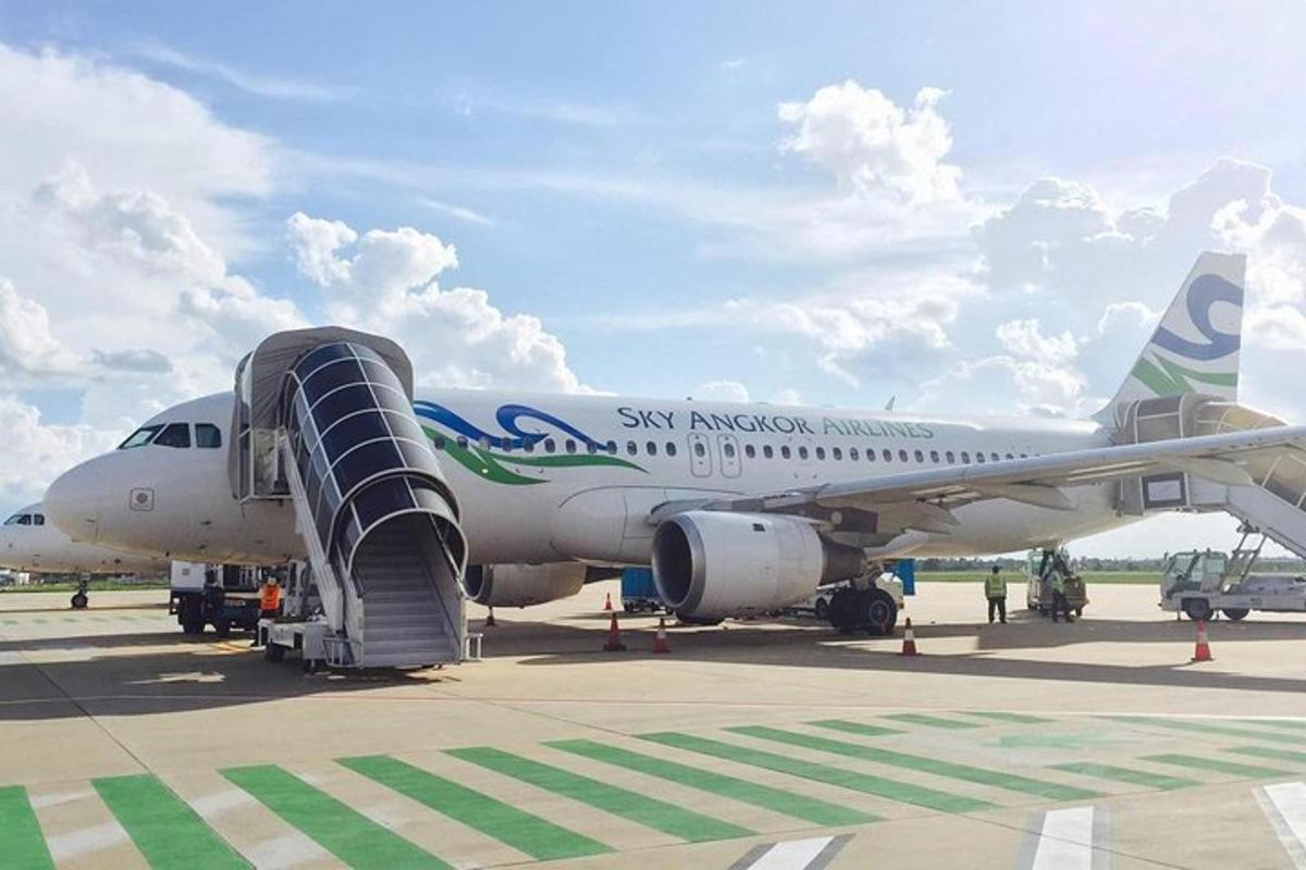 an airplane is parked on the runway at an airport