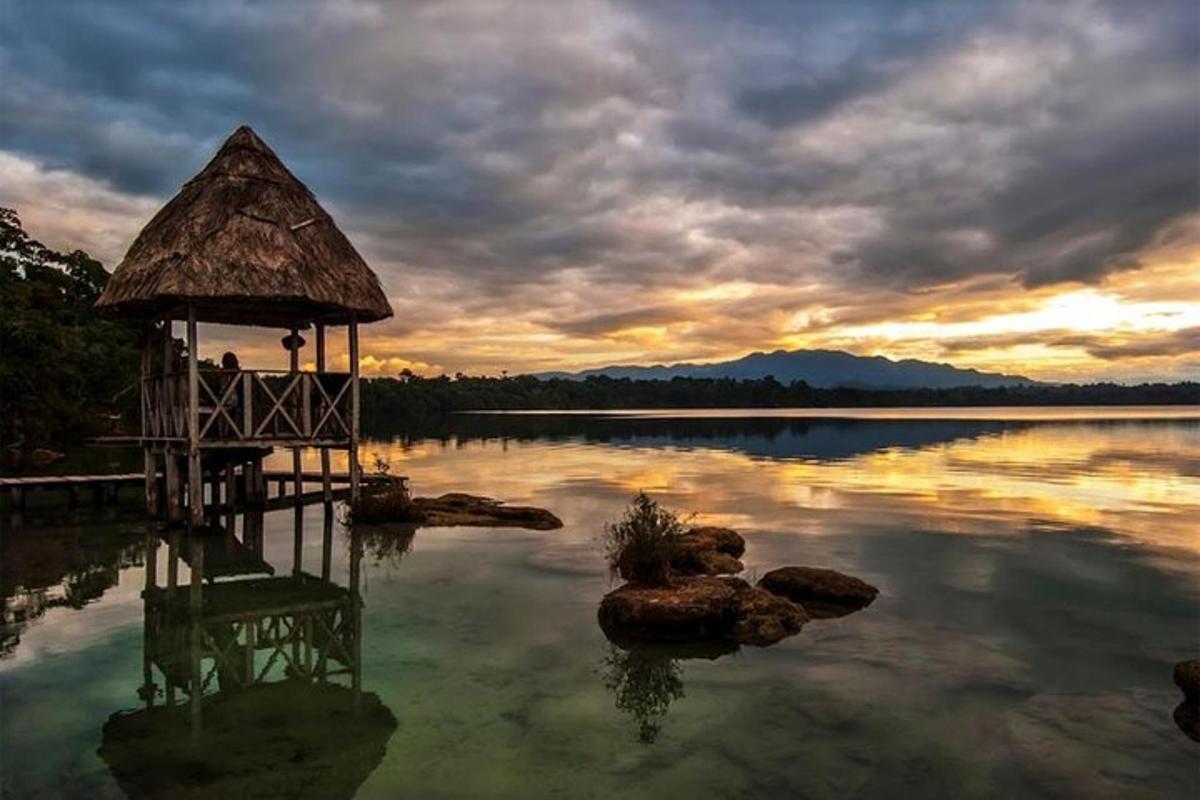a lake with a gazebo in the middle of the water