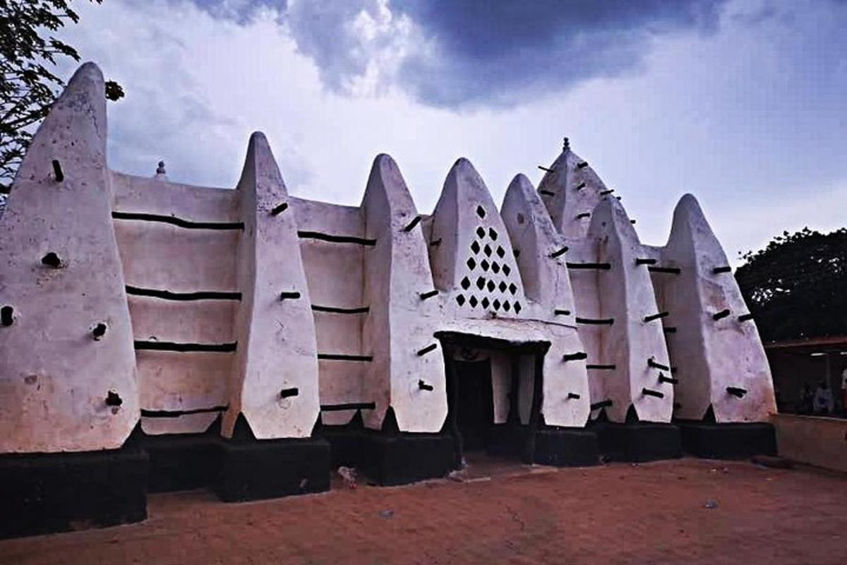 a white building with a fence around it