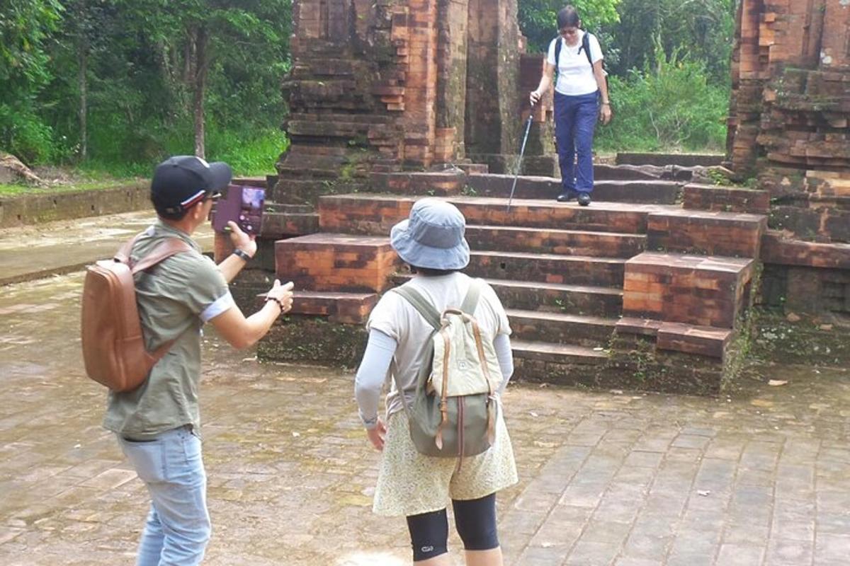 two people standing in front of a temple