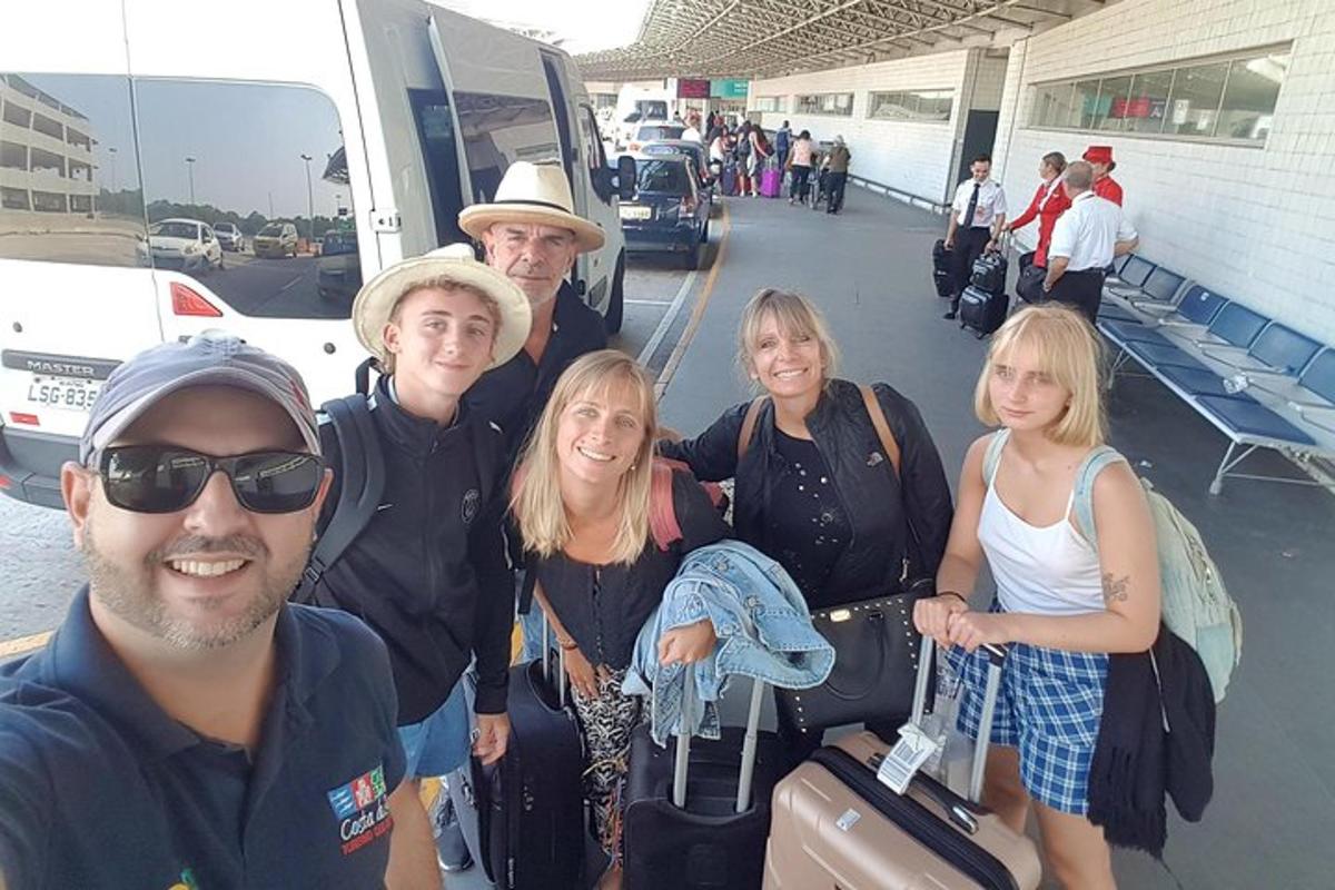 a group of people standing in front of a bus