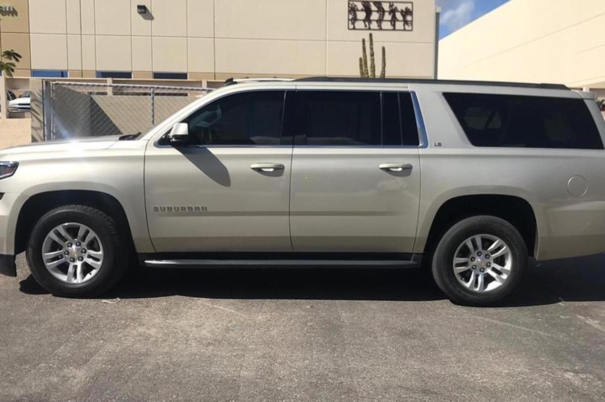 a white suv parked in a parking lot