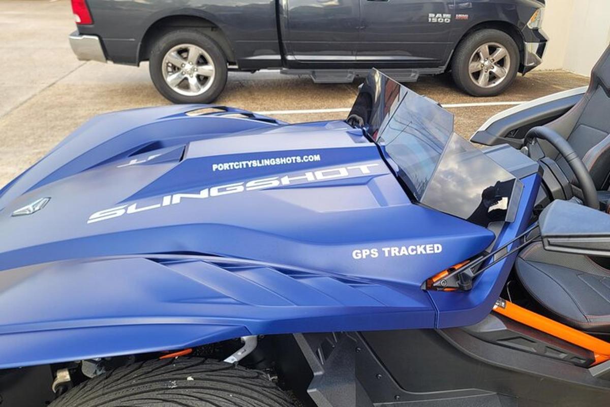 a blue motorcycle parked in a parking lot