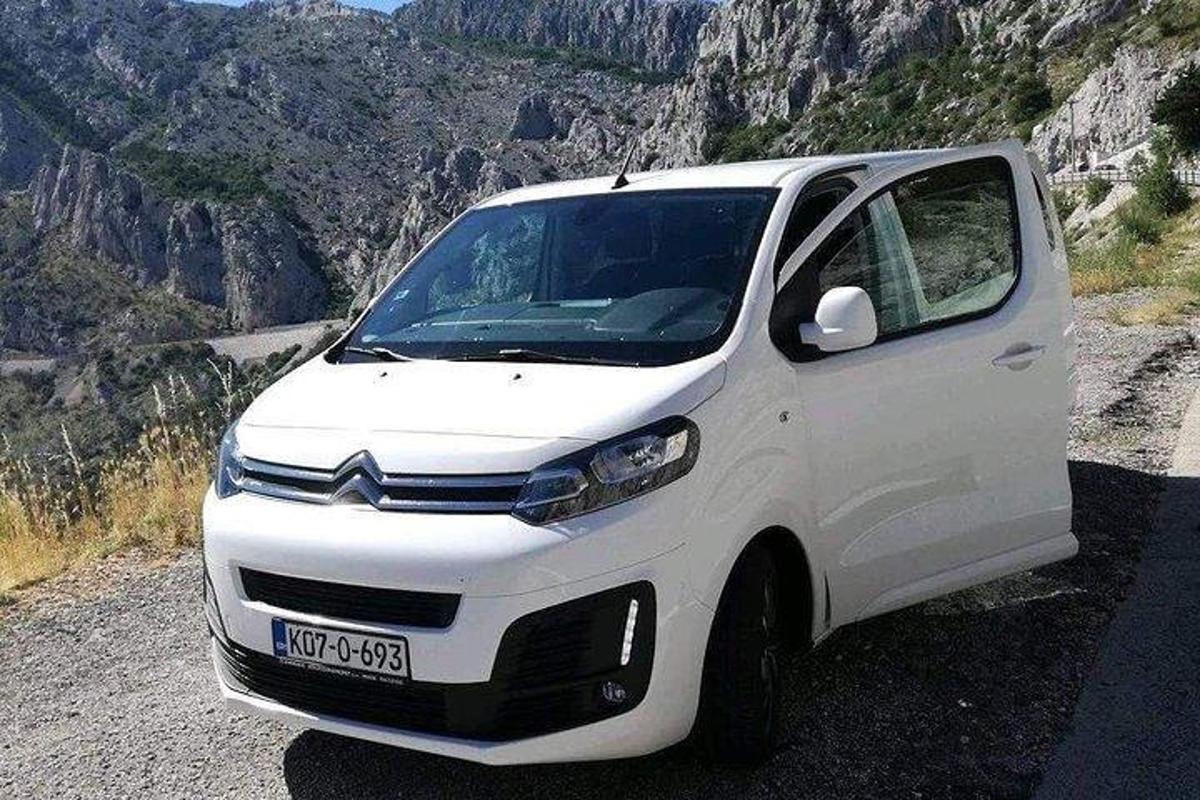 a white van parked on the side of a mountain