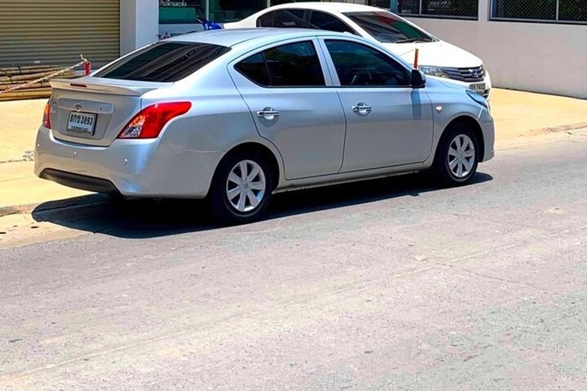 a silver car parked on the side of a street