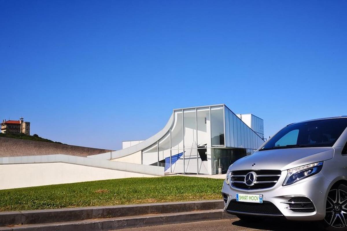 a silver car parked in front of a building