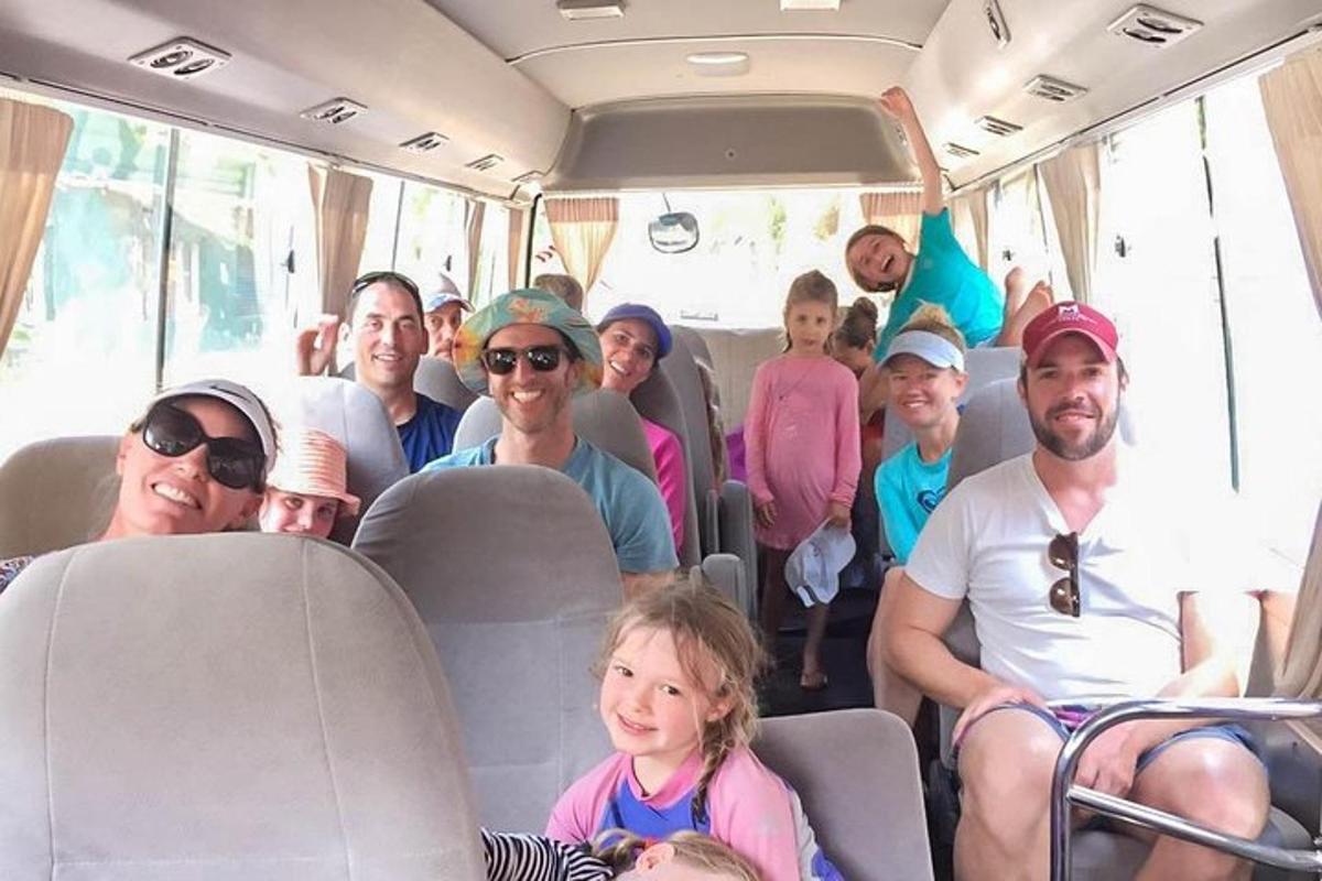 a group of people sitting on a bus