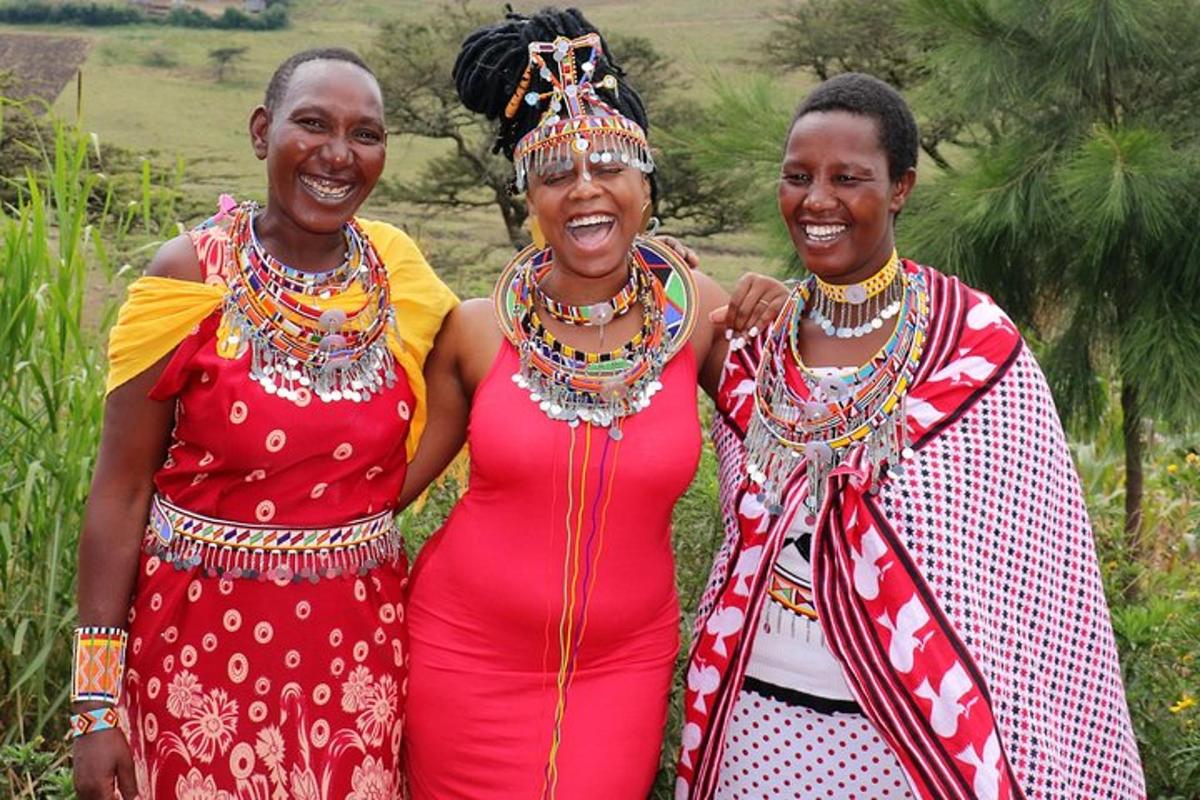 a group of three women standing next to each other