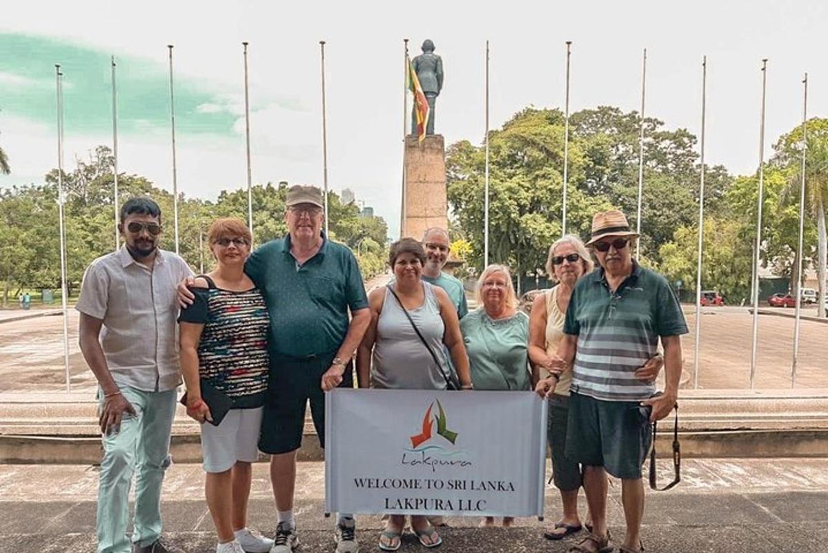 a group of people standing in front of a statue