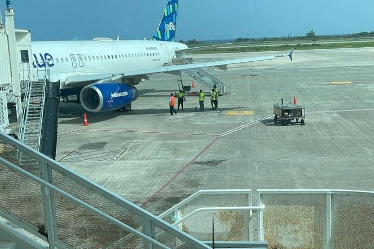 a group of people boarding an airplane on the runway