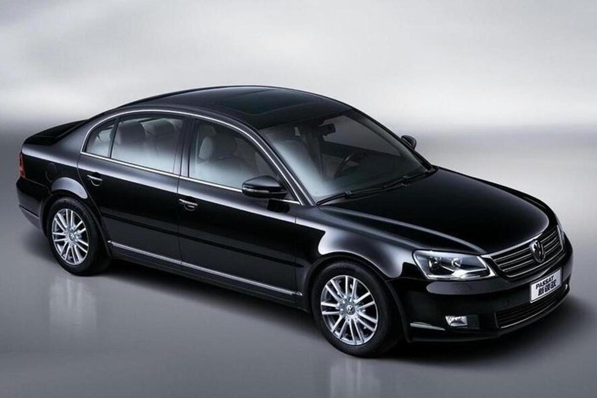 a black car parked on a white background
