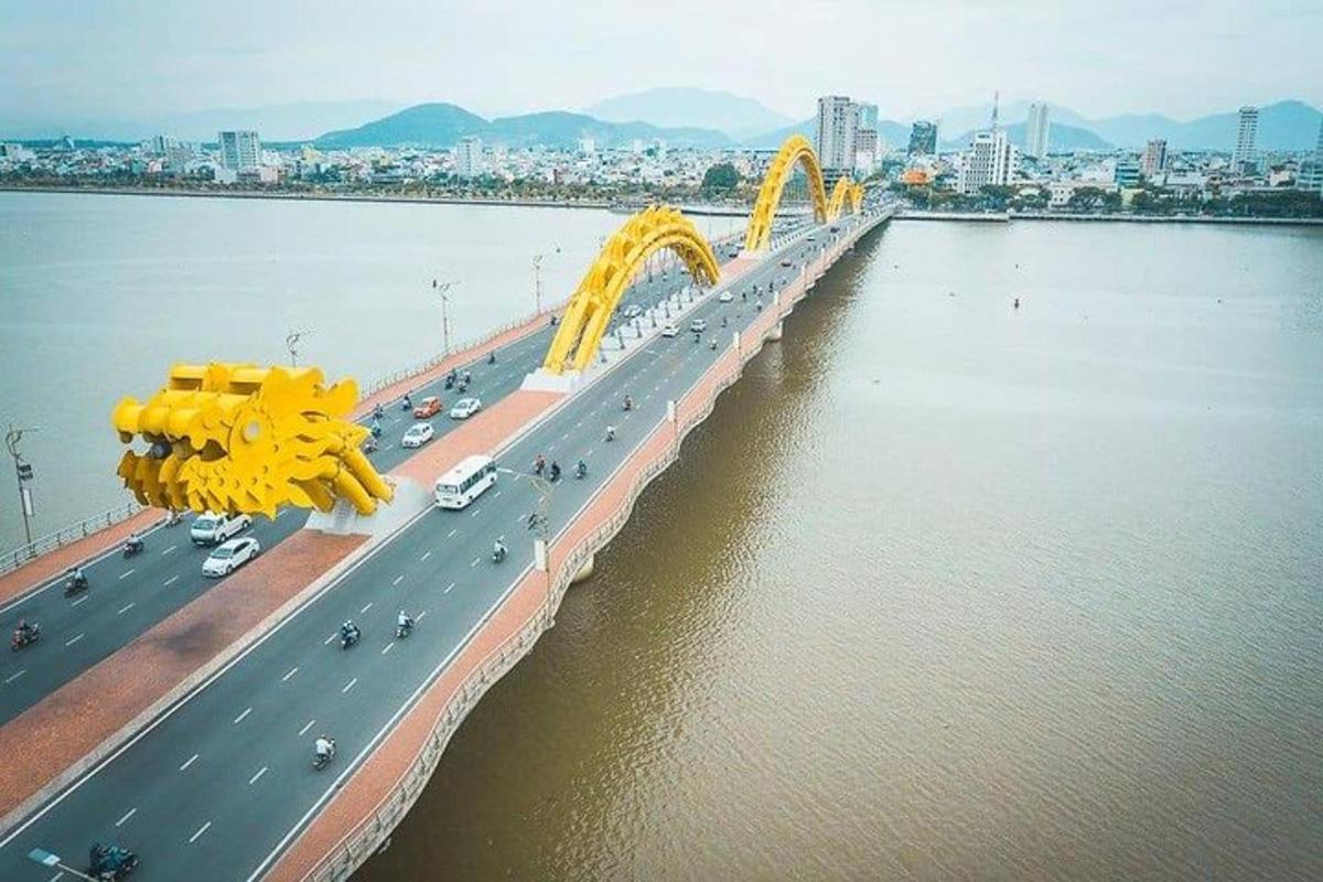 a large bridge over a river with cars on it