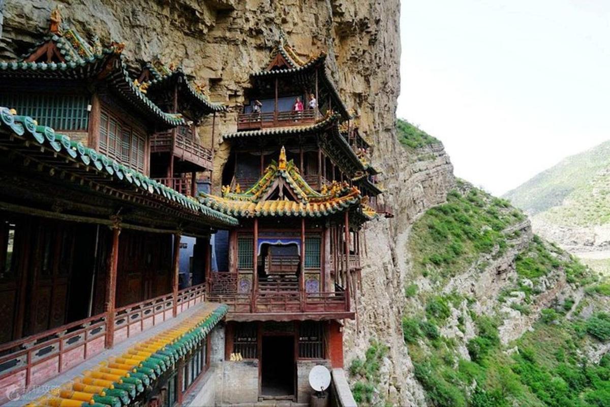 a building on the side of a mountain