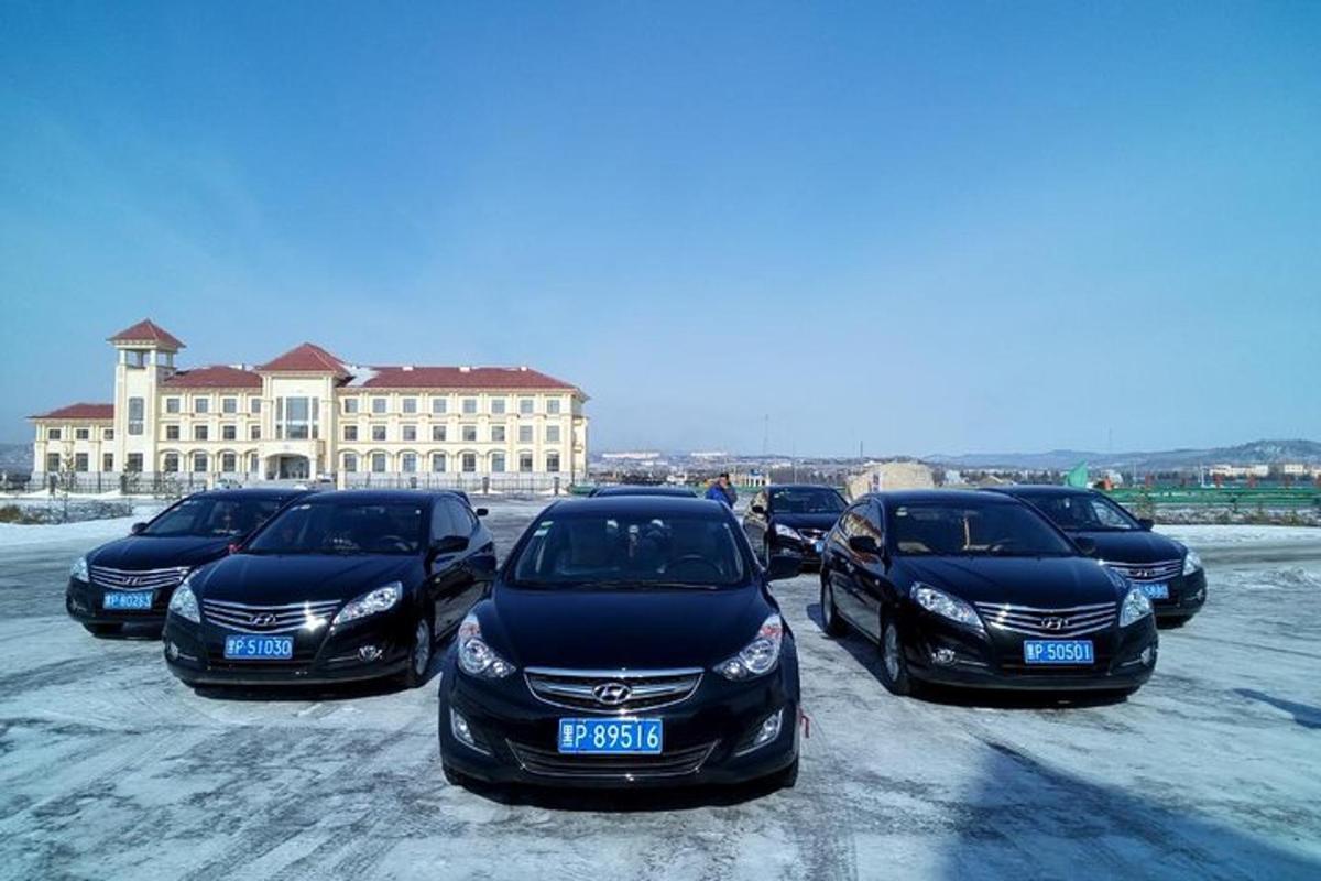 a row of parked cars in a parking lot