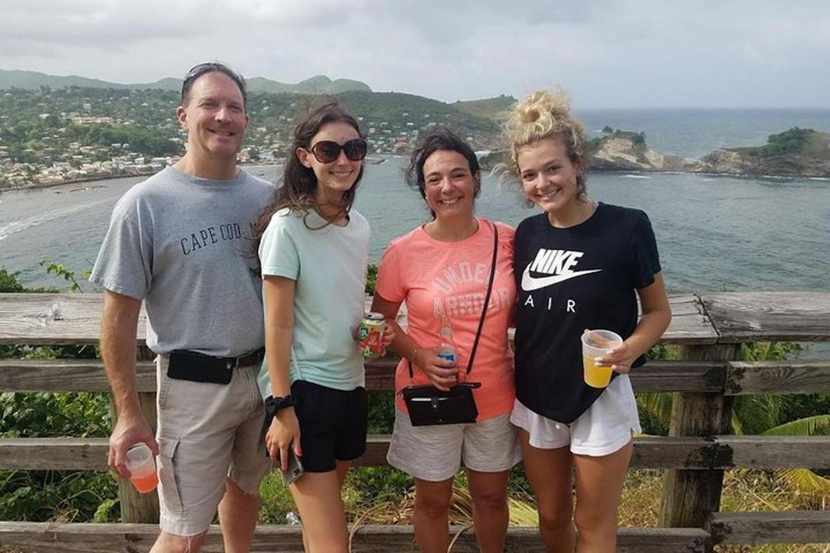 a group of people standing in front of the ocean