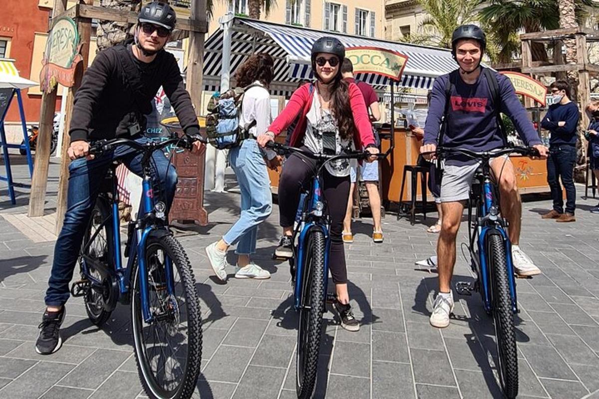 a group of people riding bikes down a street