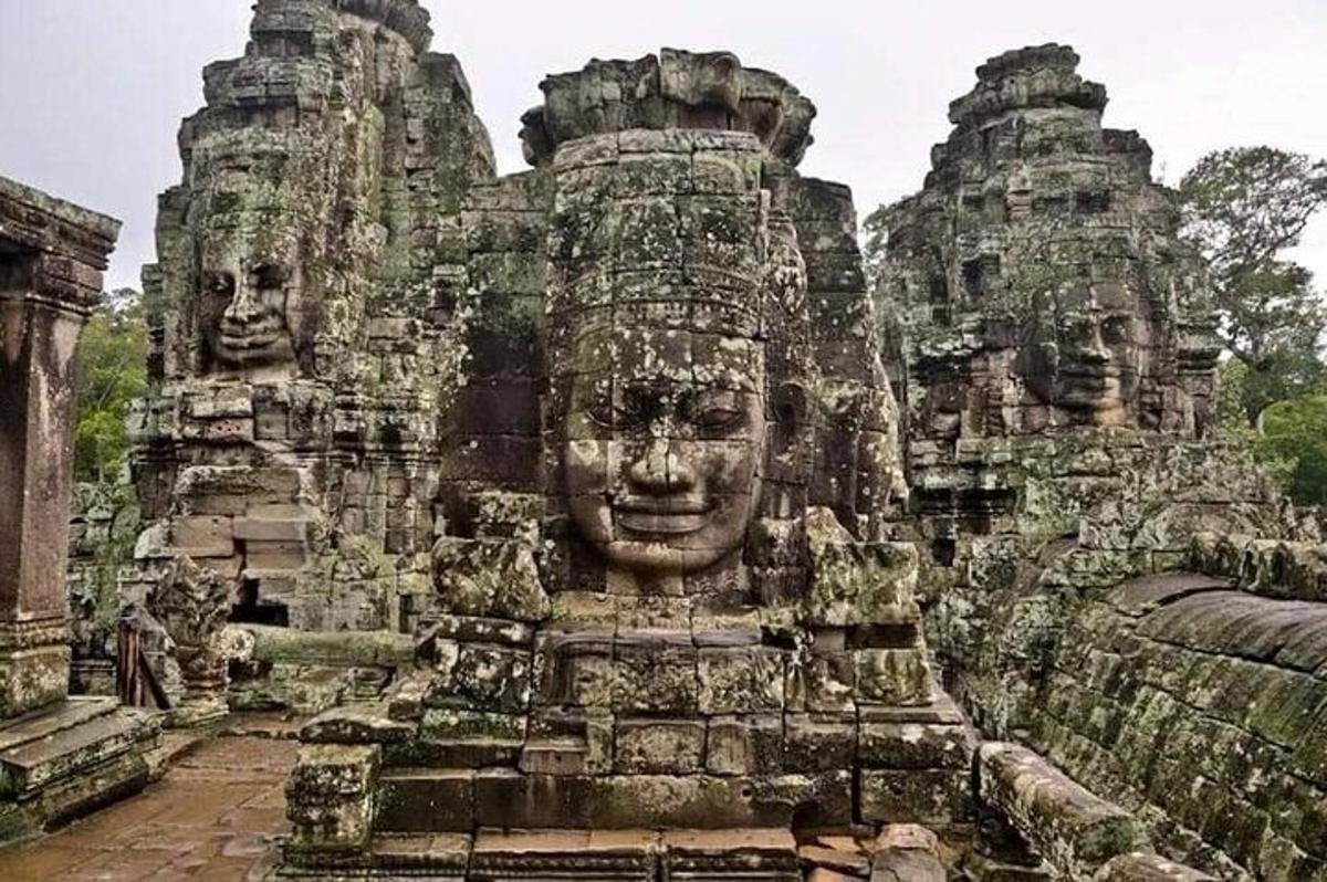 a large stone building with faces on it
