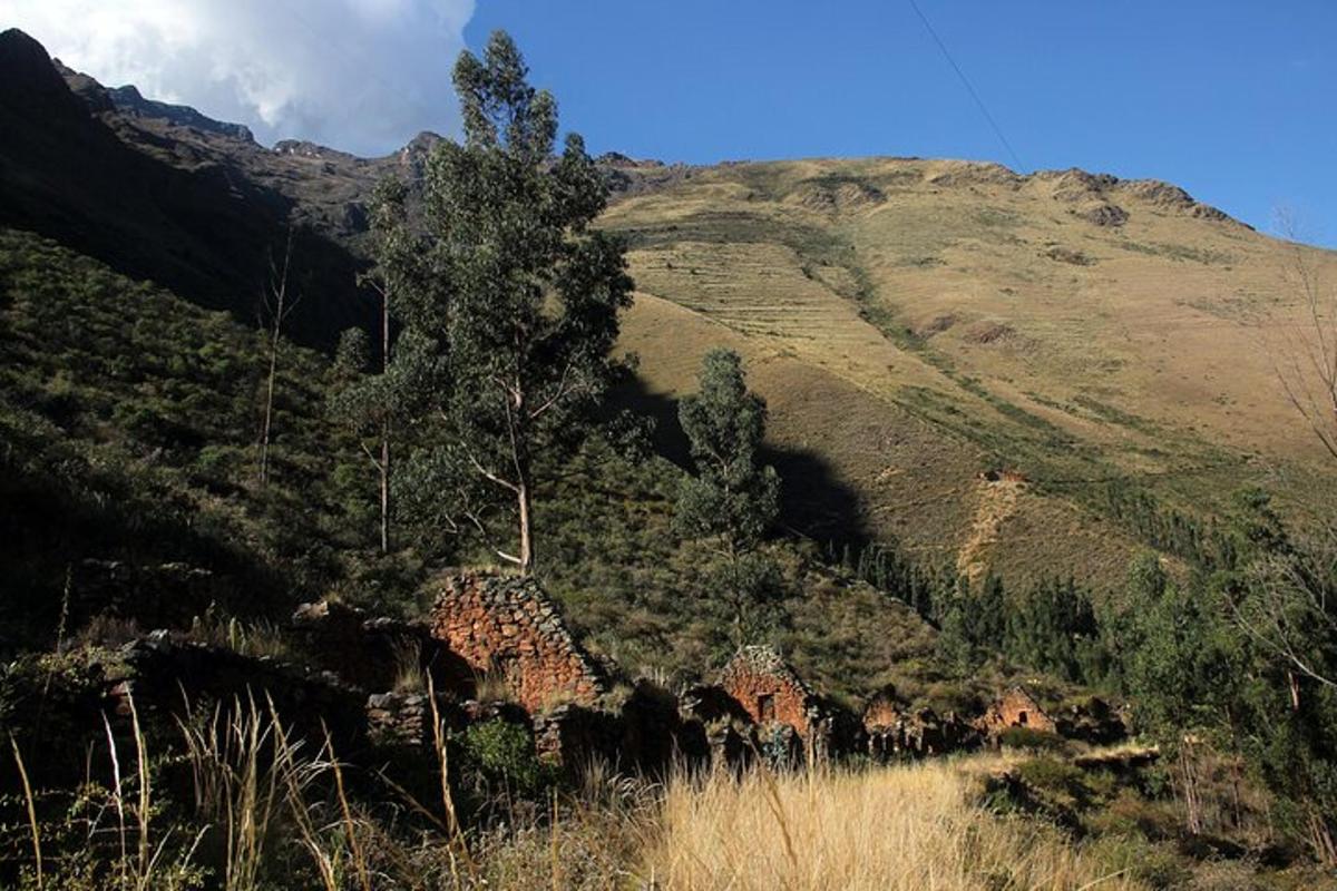 a view of a mountain with a house on a hill