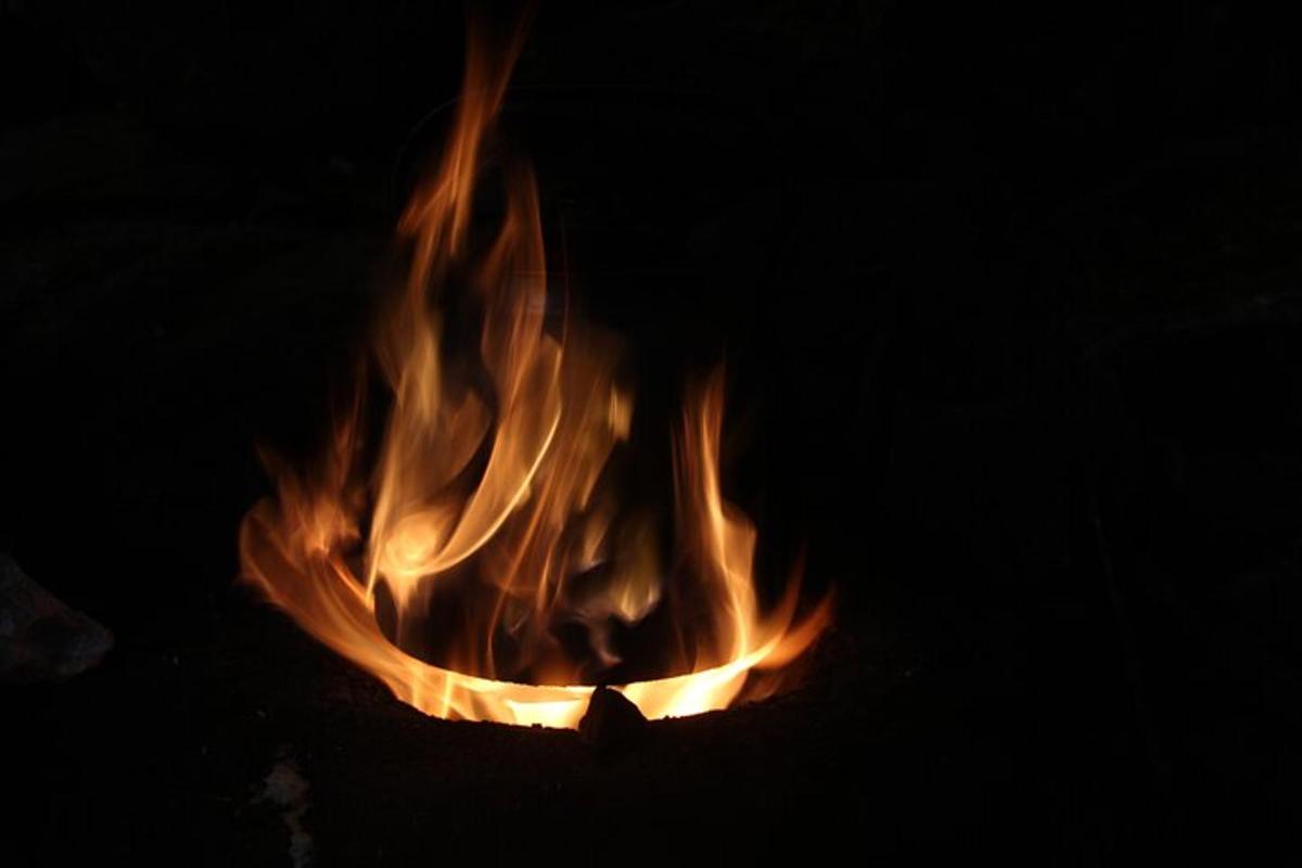 a fire is burning in the dark