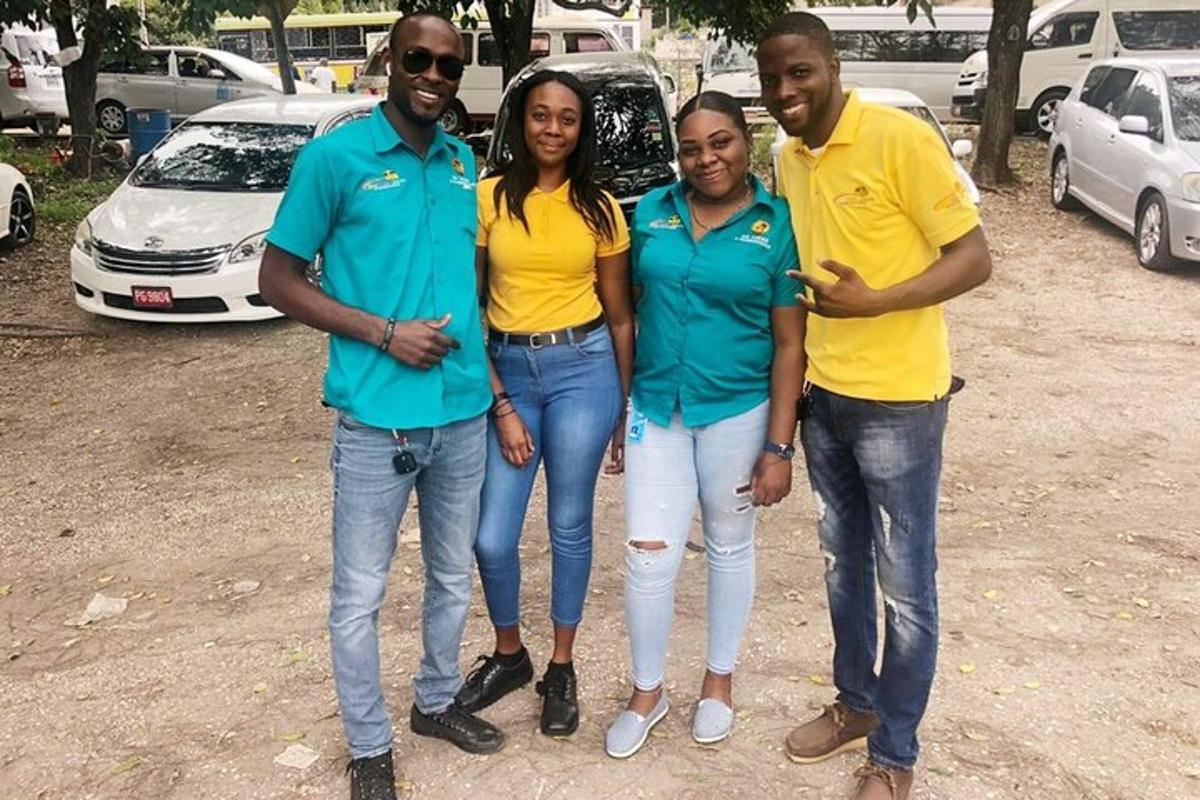 a group of four people standing in a parking lot