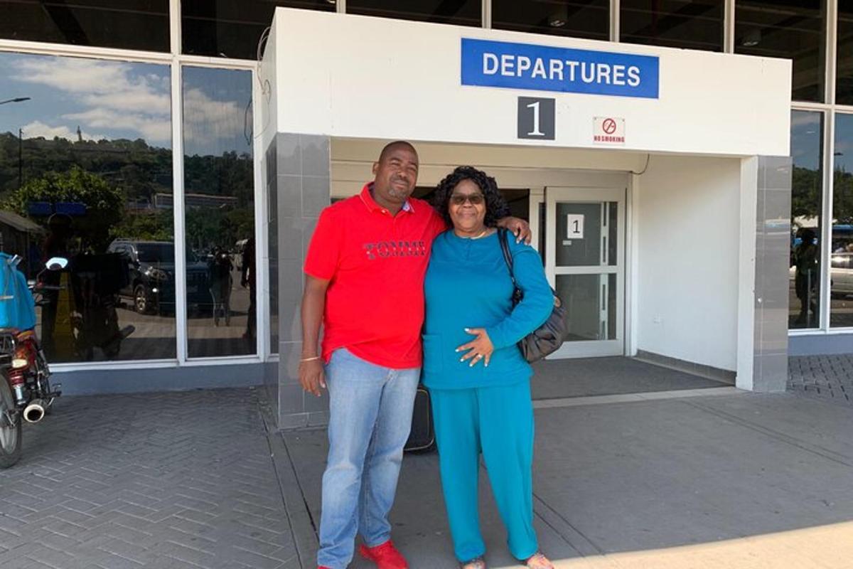 a man and a woman standing in front of a store