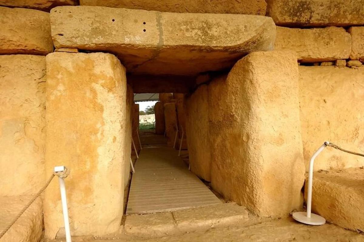 a stone wall with a tunnel in a building