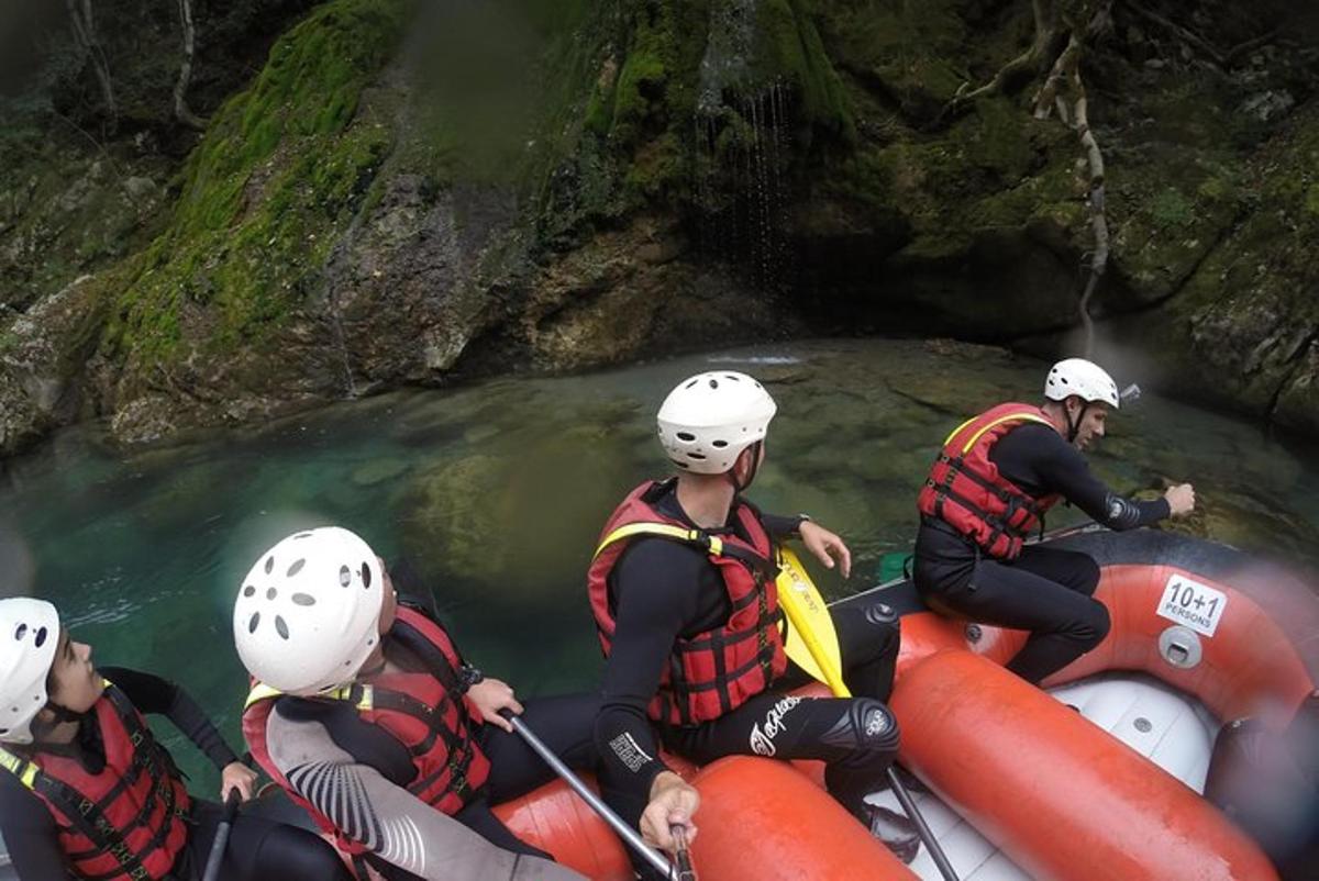 a group of people rafting down a river in a cave